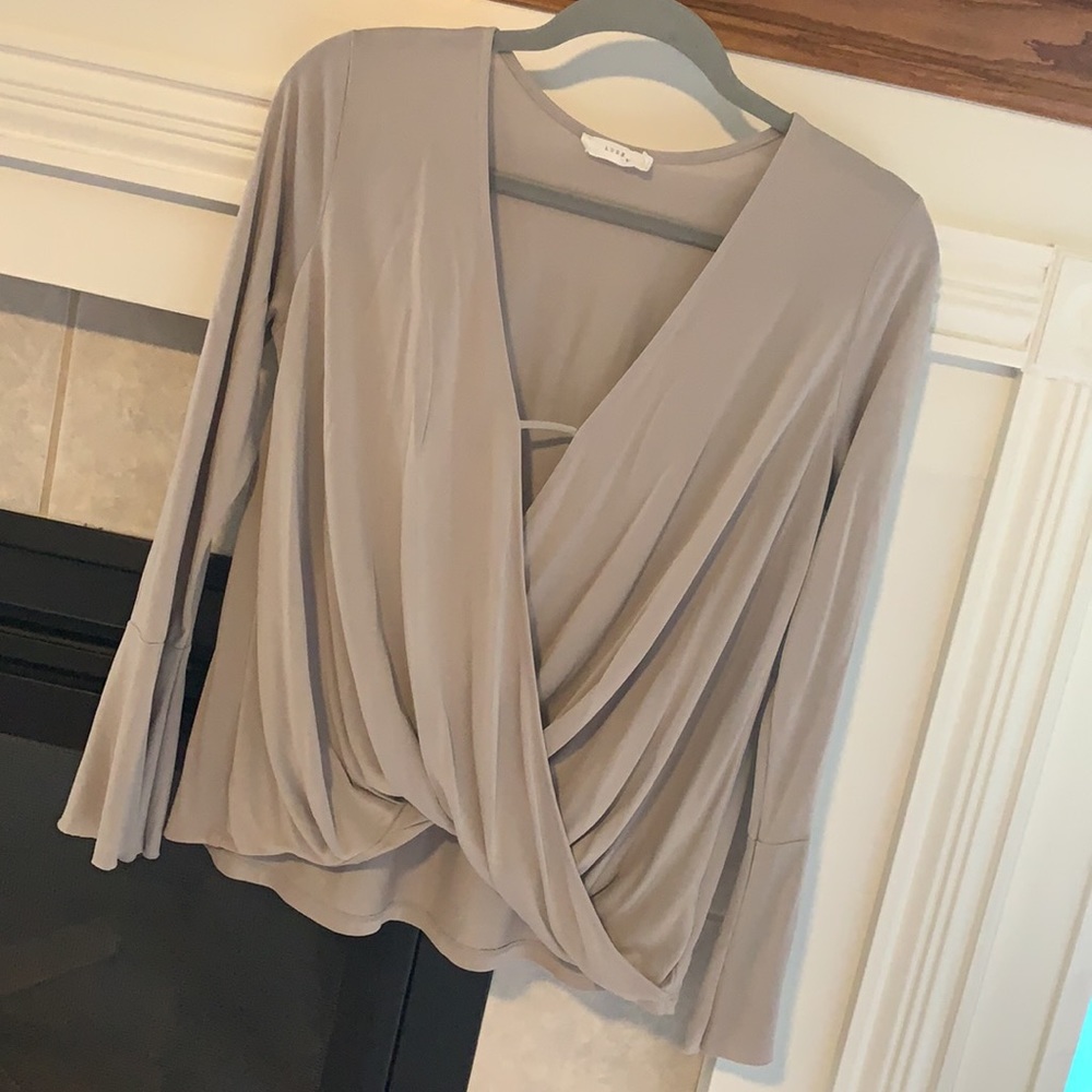 Flattering surplice Lush top with flared sleeves